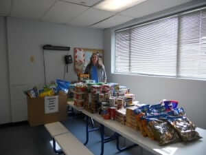 Julie Lee gathering food donations for the Tarrant Food Bank. | Fort Worth Philanthropy 2015