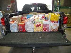 Check out what 626 pounds of food looks like; they filled the bed of a Toyota Tundra PLUS the back seat!