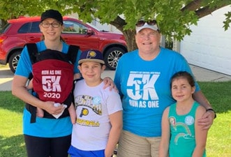 Chris and Krista participating in a Marian Inc. community event