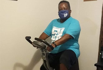 Leon biking during a Marian Inc. wellness initiative