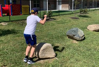 Marian Inc. team building activity involving rock climbing