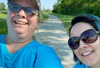 Terri and Ana participating in a Marian Inc. community event