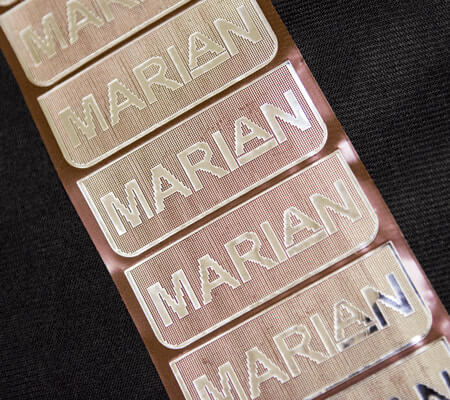 Laser metalized mylar featuring Marian branding